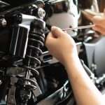 NFS Auto Tech Replacing Old Suspensions on a Car