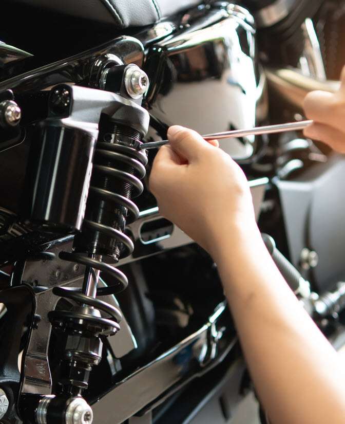 NFS Auto Tech Replacing Old Suspensions on a Car